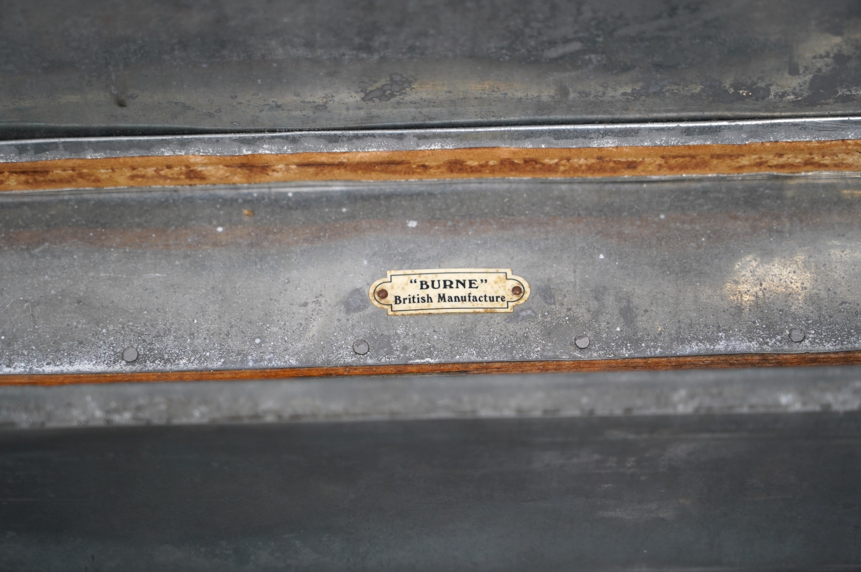 A pine military trunk with steel banding to all edges and corners, and original tin lining, owner’s name painted to the lid; ‘Major W.H. Postle R.A.O.C.’, 91.5cm wide, 54cm deep, 53cm high. Condition - fair to good
